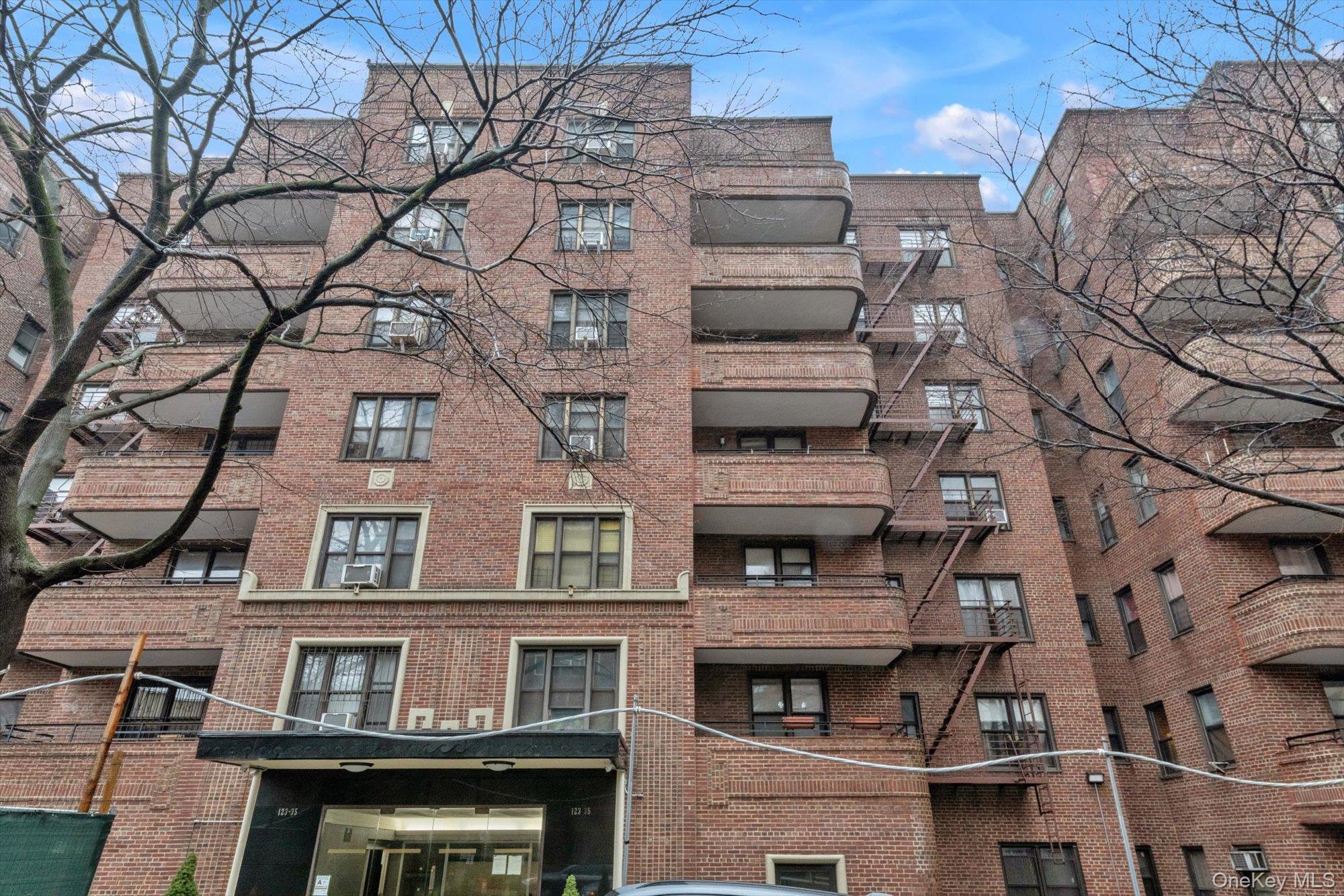 a view of a building with a tree