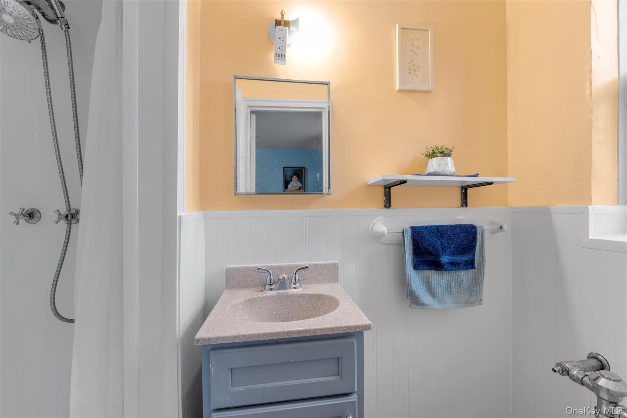 123-35 82nd Road, Unit 5C Queens, NY 11415 - Photo 12 of 21 a bathroom with a sink toilet and mirror