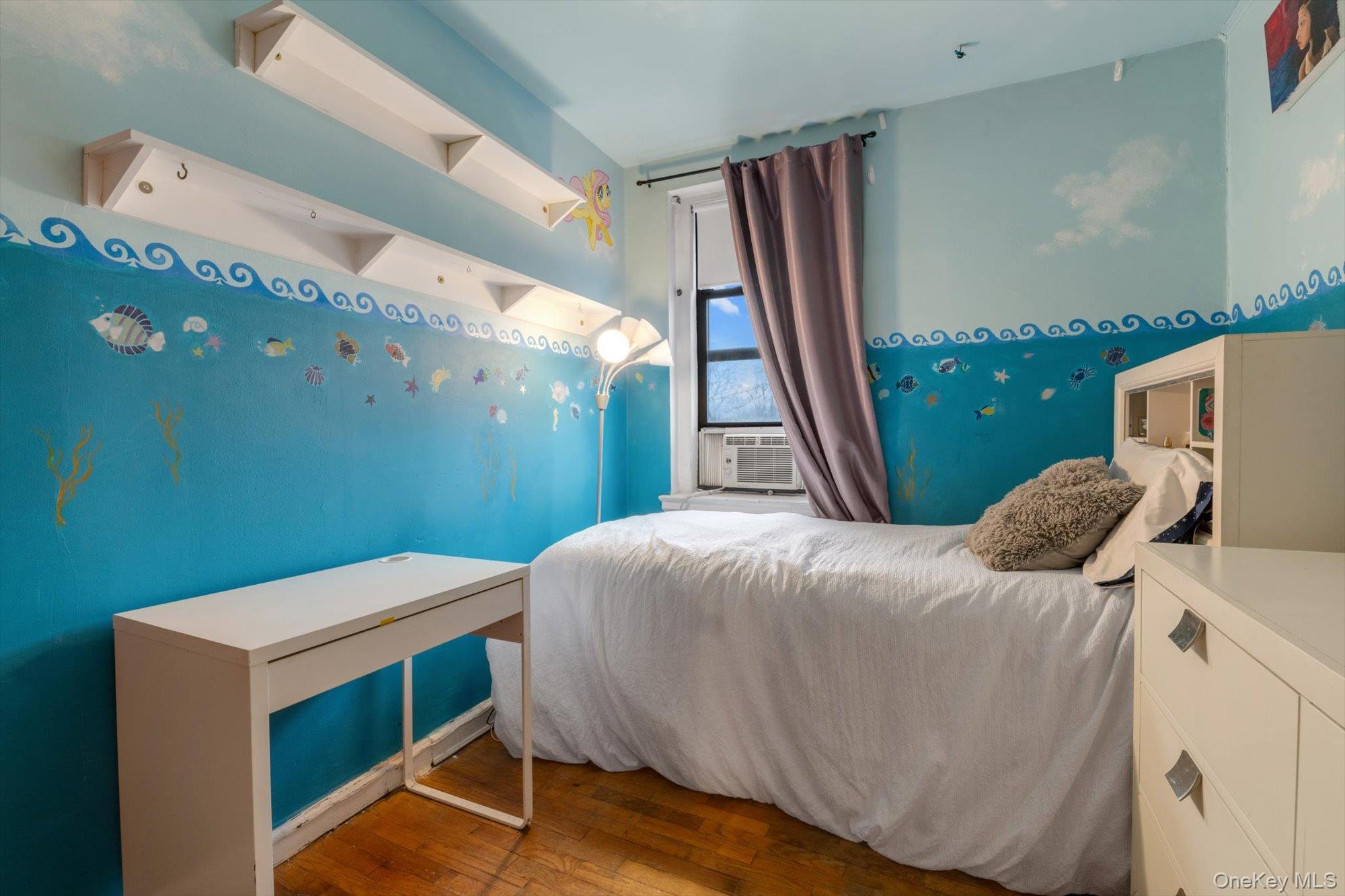 123-35 82nd Road, Unit 5C Queens, NY 11415 - Photo 13 of 21 a bedroom with a bed and a window