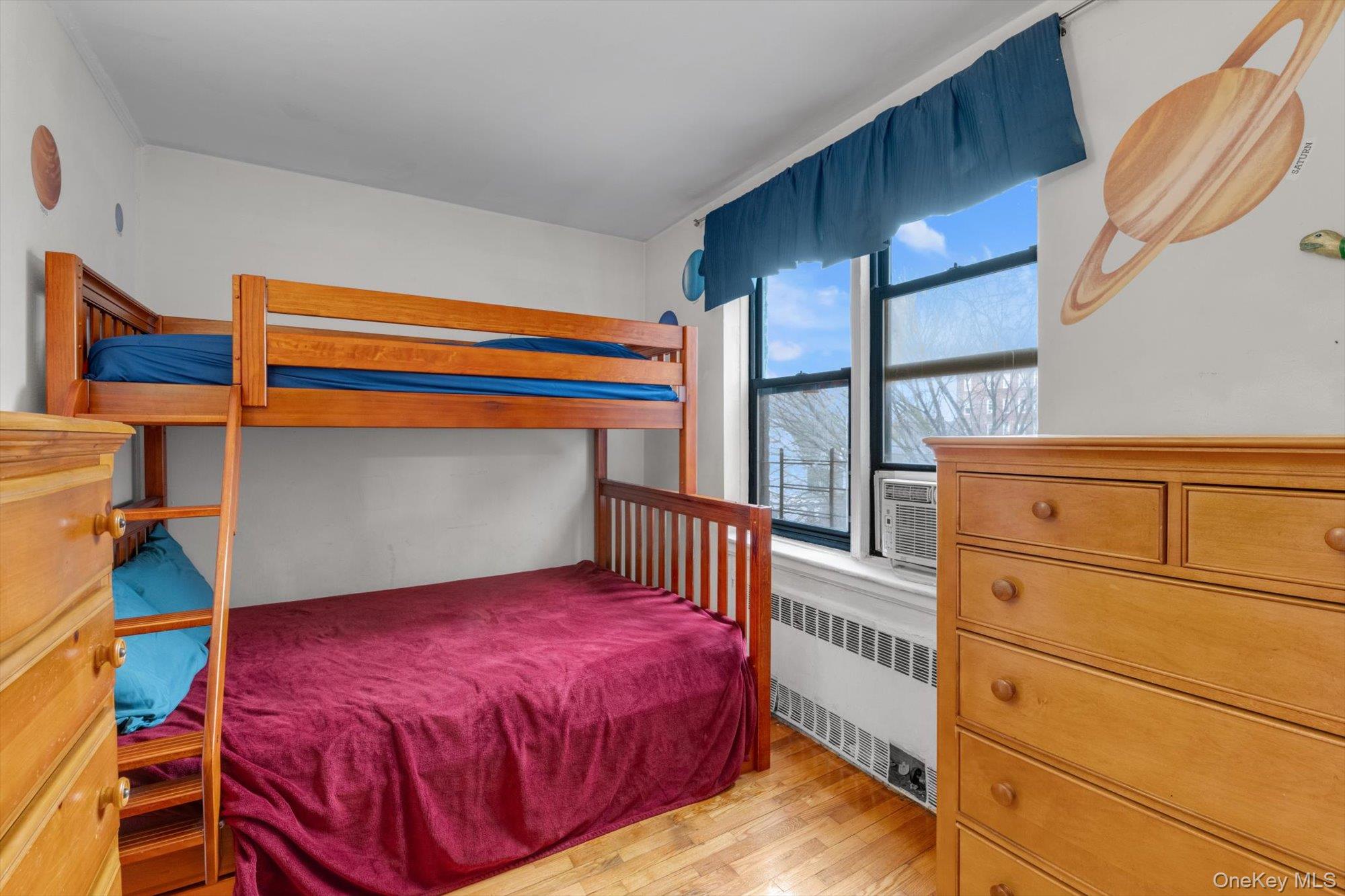 123-35 82nd Road, Unit 5C Queens, NY 11415 - Photo 15 of 21 a bedroom with a bed and a window
