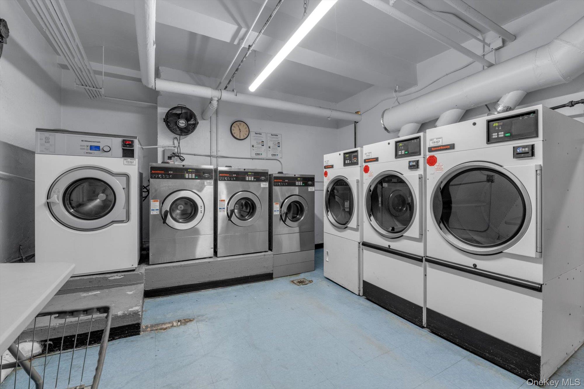 123-35 82nd Road, Unit 5C Queens, NY 11415 - Photo 19 of 21 a utility room with dryer washer and dryer