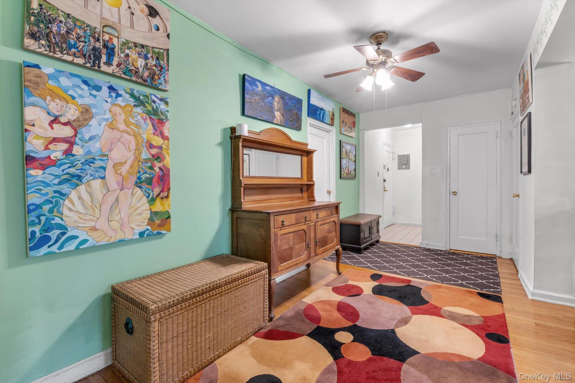 123-35 82nd Road, Unit 5C Queens, NY 11415 - Photo 3 of 21 a living room with furniture and flat screen tv