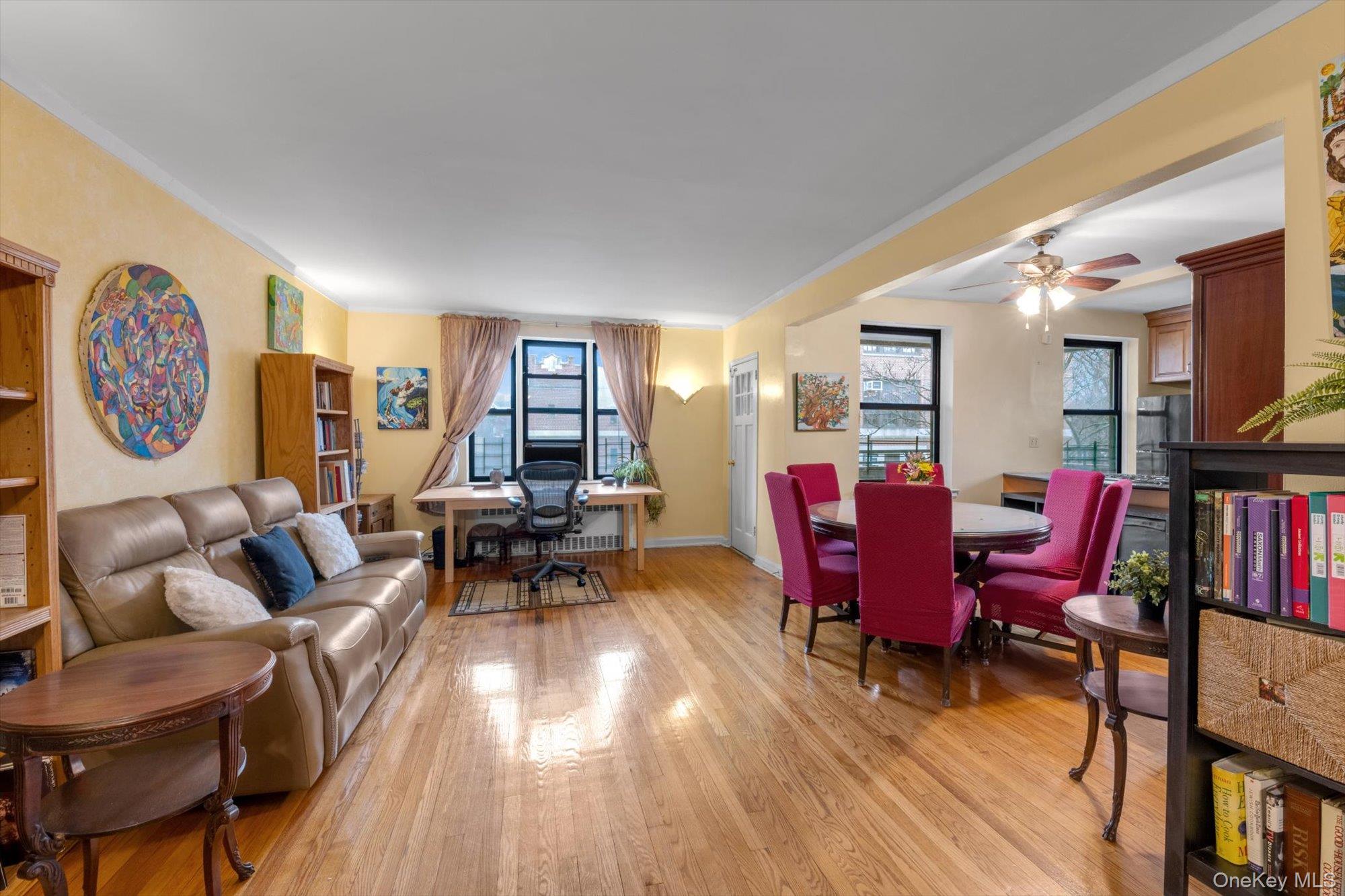 123-35 82nd Road, Unit 5C Queens, NY 11415 - Photo 4 of 21 a living room with furniture and a book shelf