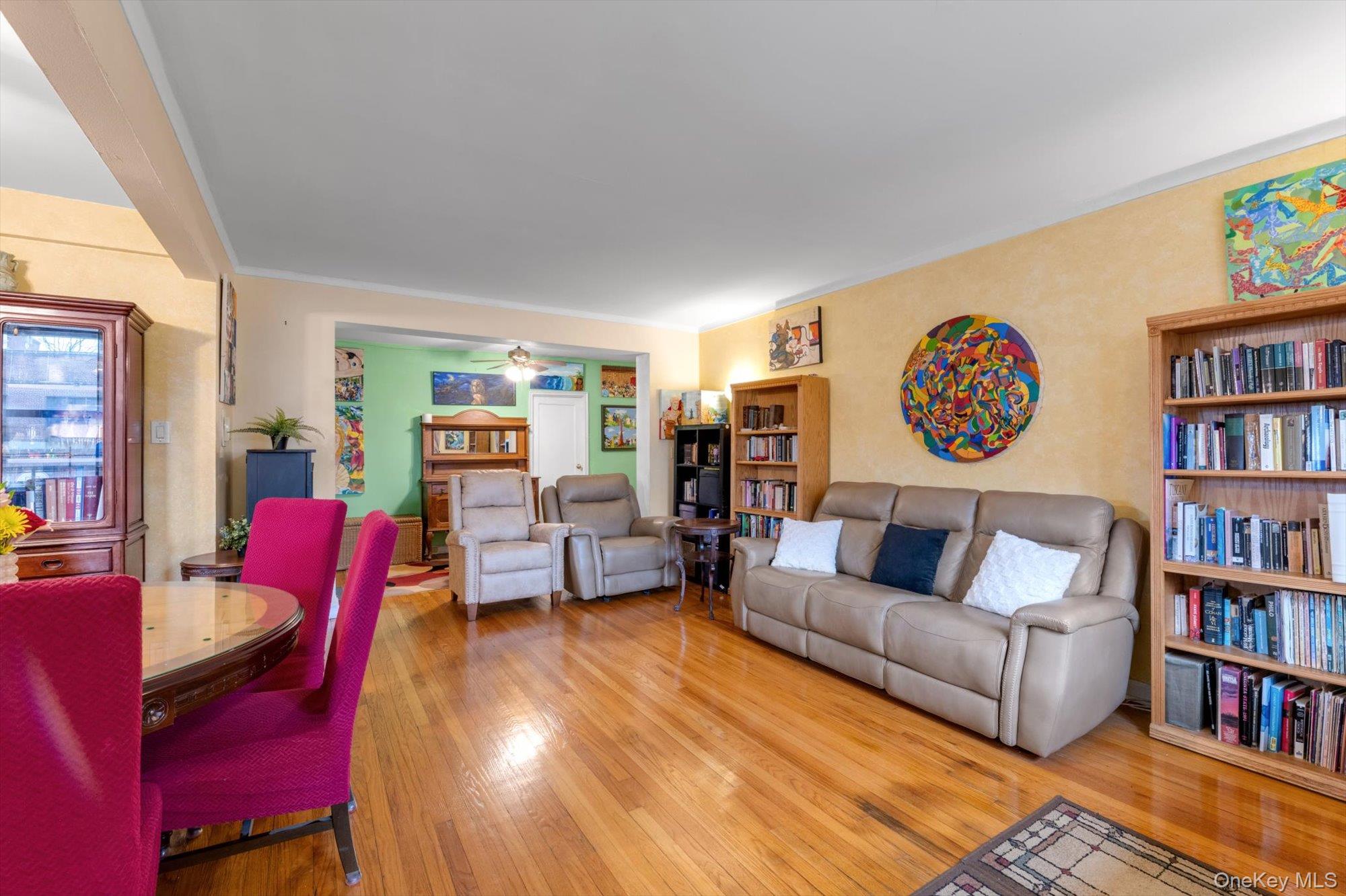 123-35 82nd Road, Unit 5C Queens, NY 11415 - Photo 5 of 21 a living room with furniture and a book shelf