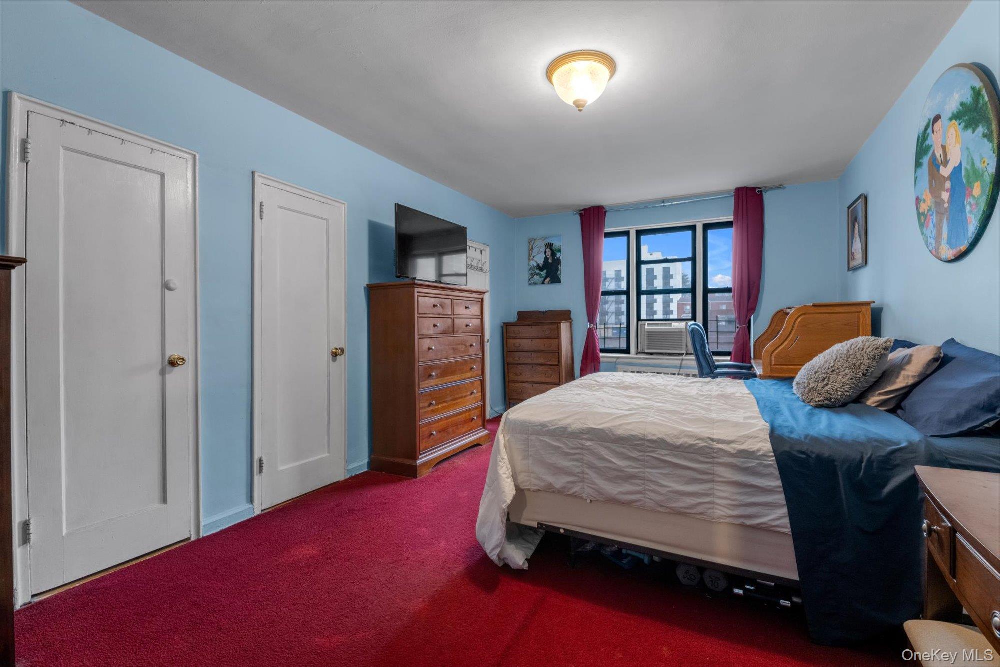 123-35 82nd Road, Unit 5C Queens, NY 11415 - Photo 10 of 21 a bedroom with a bed and a closet