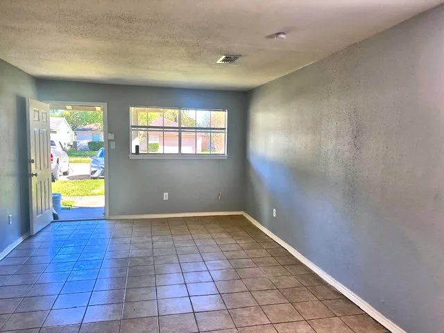 a view of an empty room and window