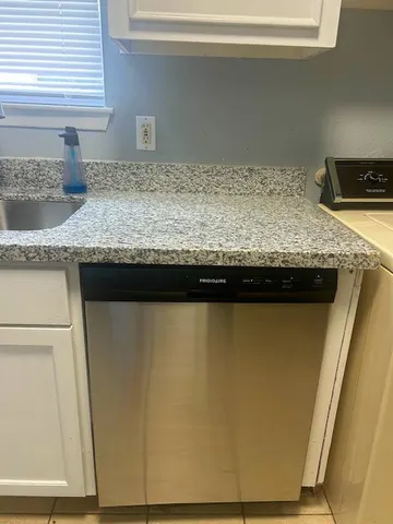 a sink sitting on top of a granite counter