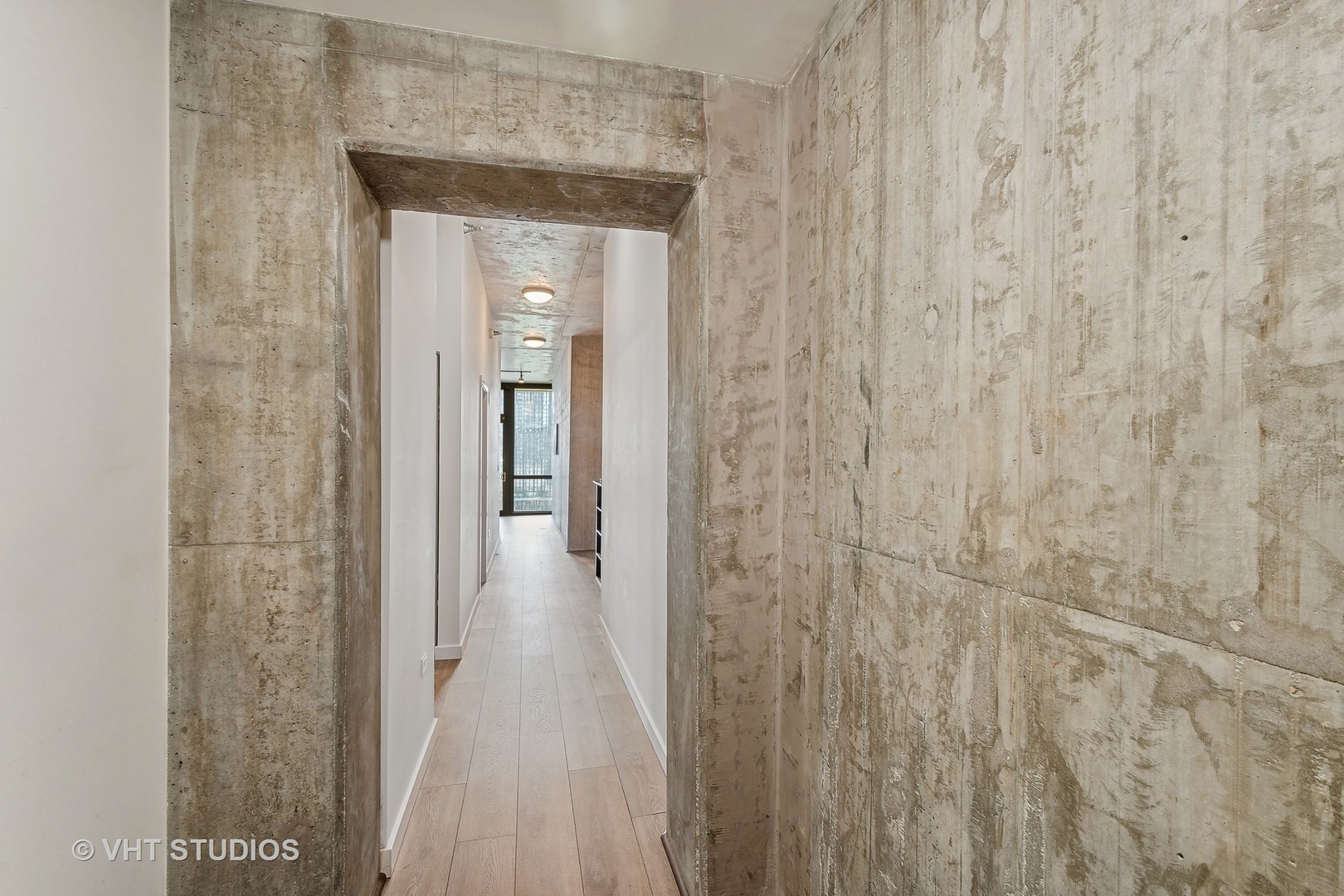 235 West Van Buren Street, Unit 1809 Chicago, IL 60607 - Photo 8 of 13 a view of a bathroom from a hallway