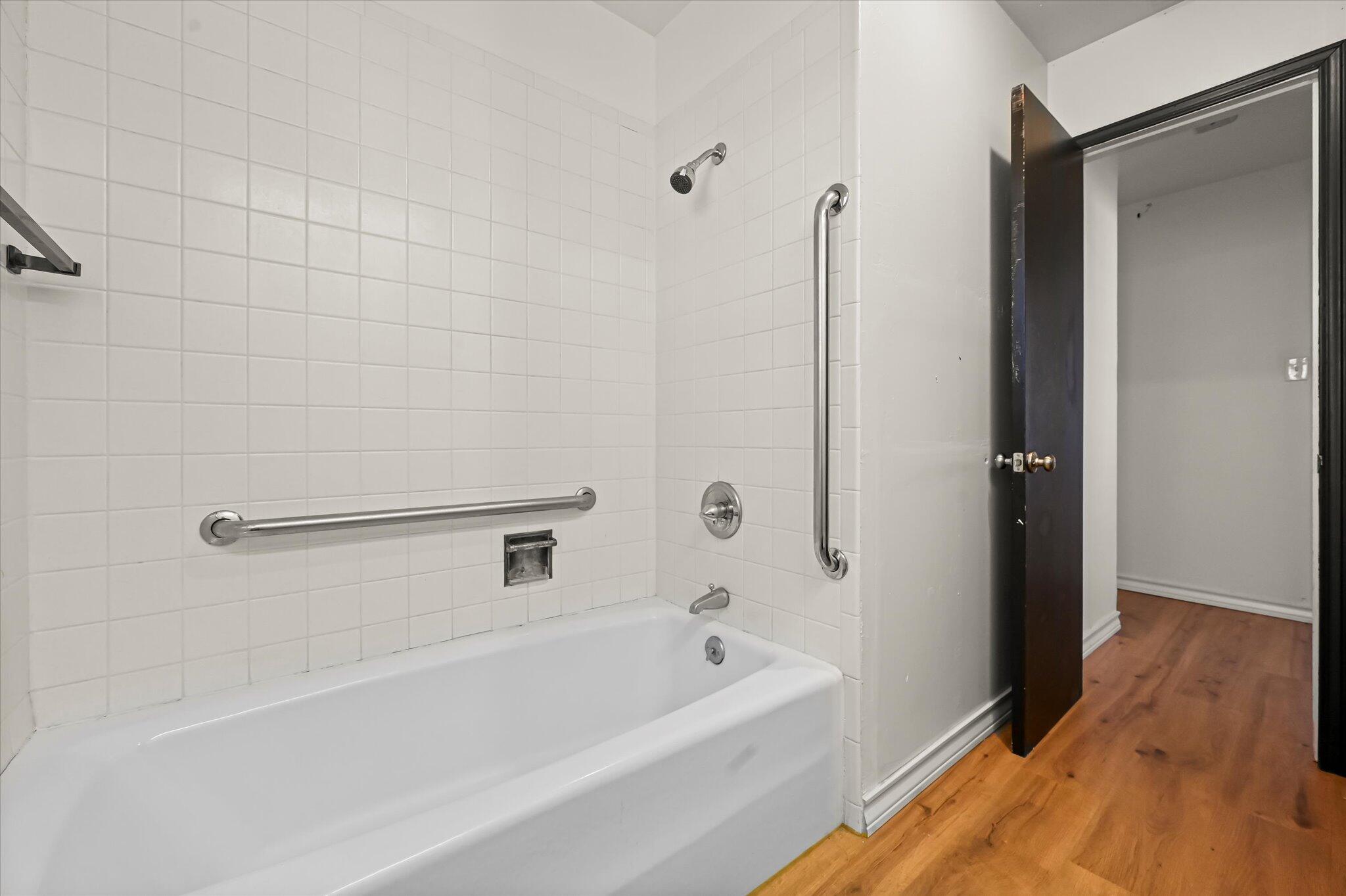 3707 25th Street Lubbock, TX 79410 - Photo 18 of 29 a bathroom with a bathtub