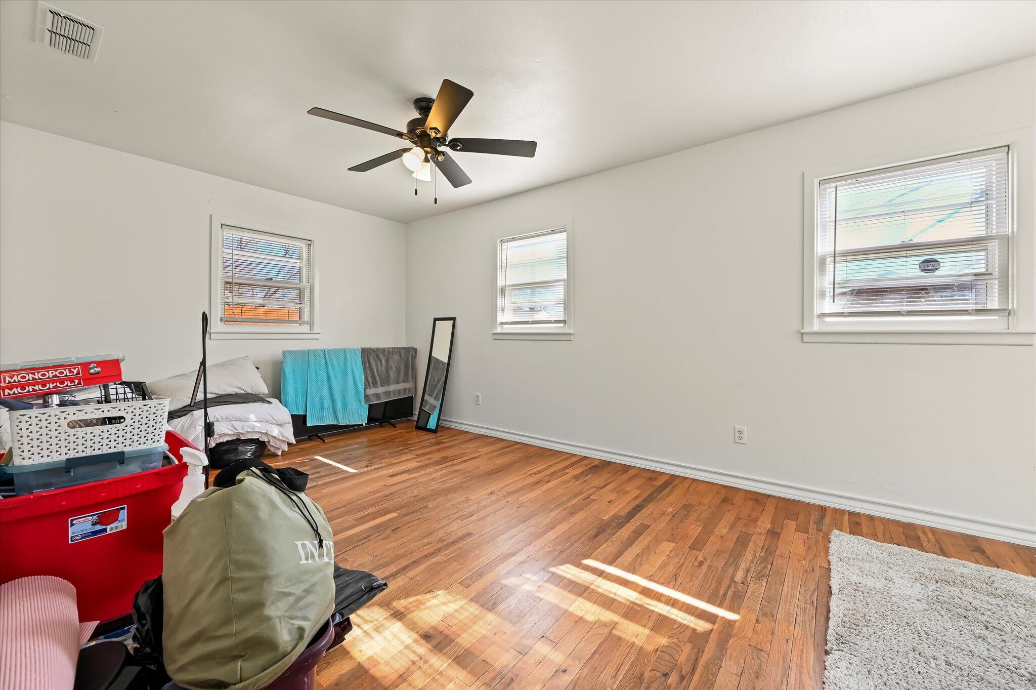 3707 25th Street Lubbock, TX 79410 - Photo 20 of 29 a bed room with a bed and a window
