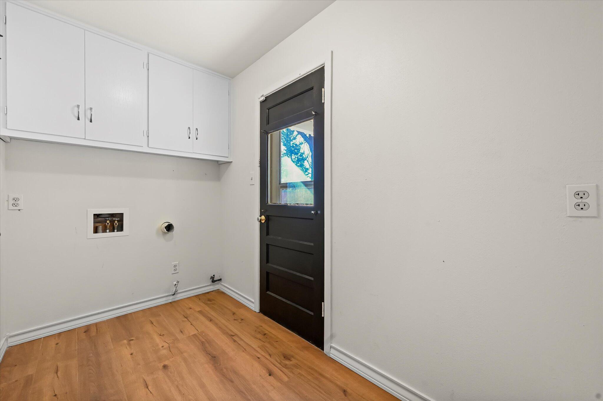 3707 25th Street Lubbock, TX 79410 - Photo 24 of 29 a view of empty room with wooden floor and cabinet