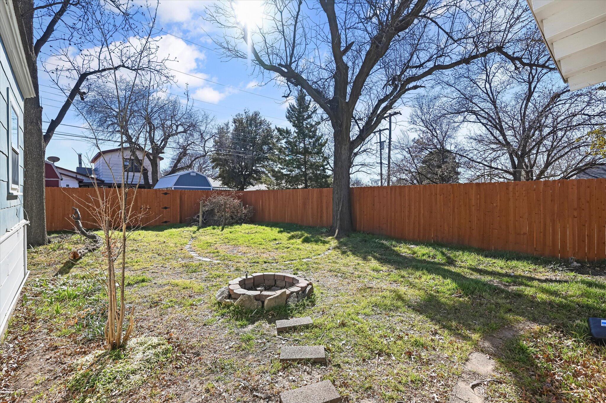 3707 25th Street Lubbock, TX 79410 - Photo 25 of 29 a backyard of a house with lots of green space