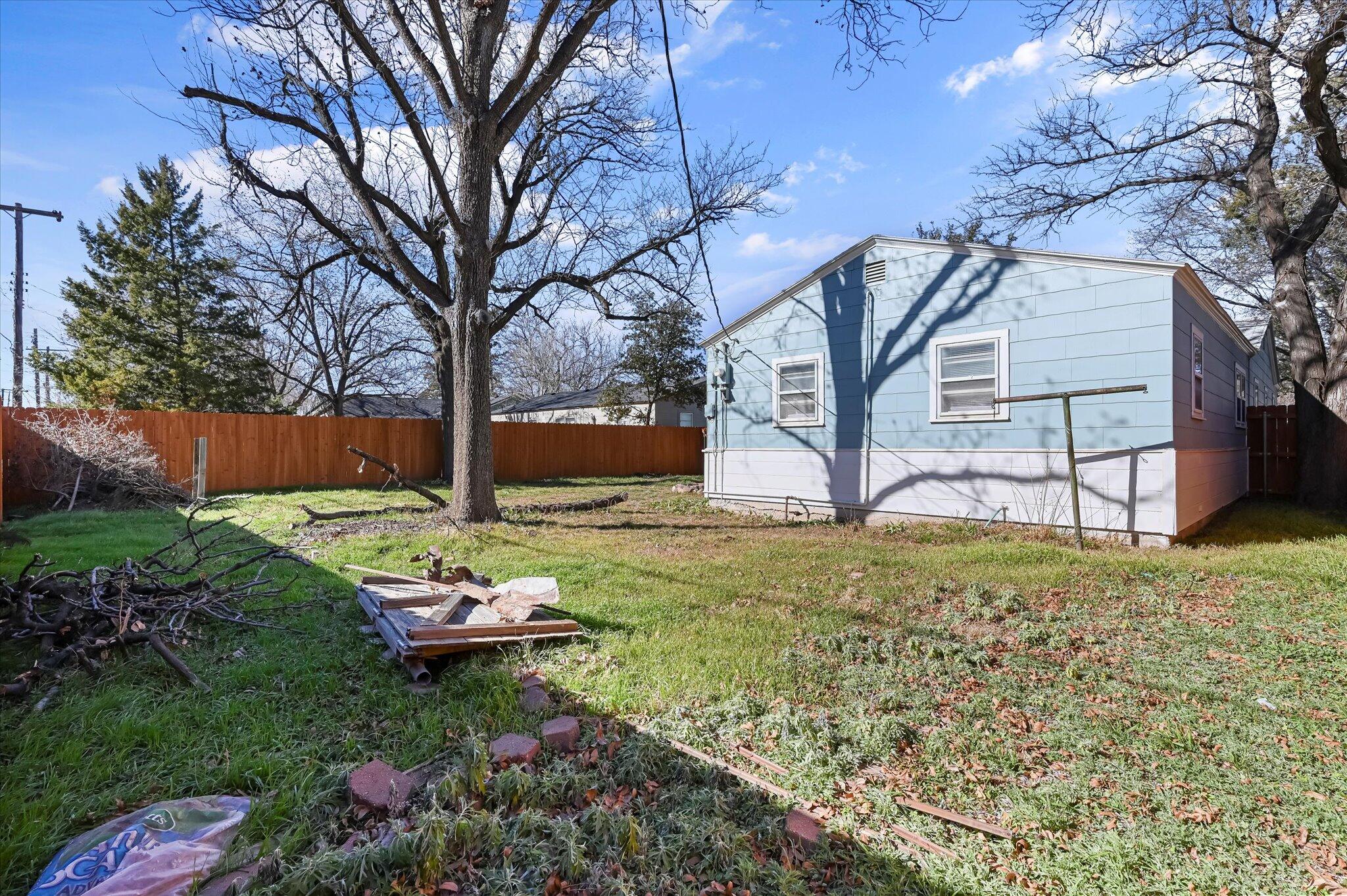 3707 25th Street Lubbock, TX 79410 - Photo 27 of 29 a backyard of a house with table and chairs