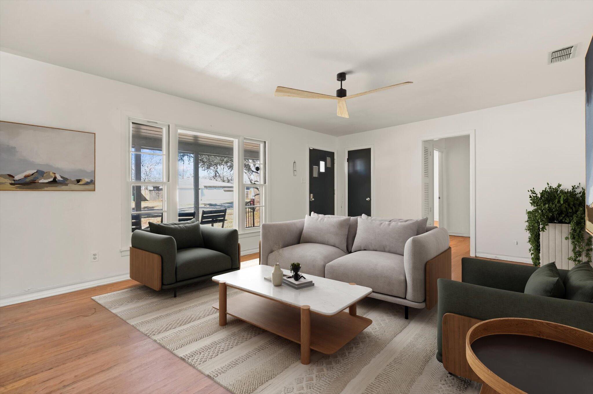 3707 25th Street Lubbock, TX 79410 - Photo 3 of 29 a living room with furniture and a large window