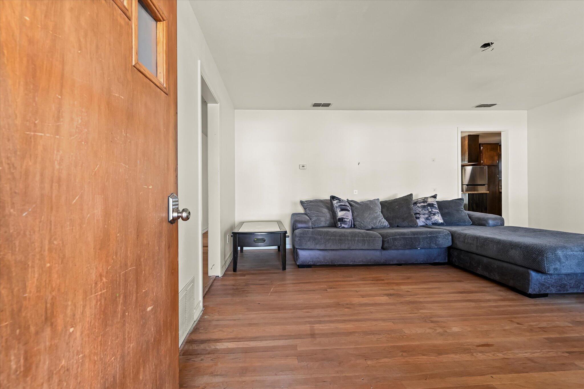 3707 25th Street Lubbock, TX 79410 - Photo 5 of 29 a living room with a couch and a window