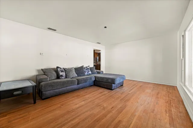 a bedroom with a large bed and a large window