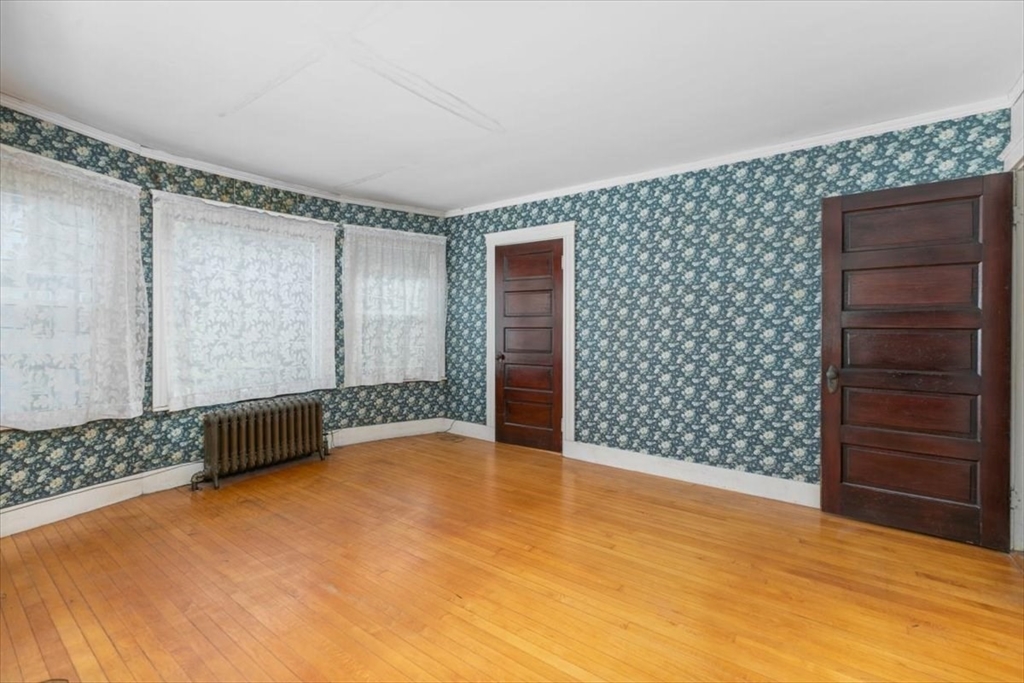 98 Webster Street Haverhill, MA 01830 - Photo 19 of 42 a view of an empty room with wooden floor