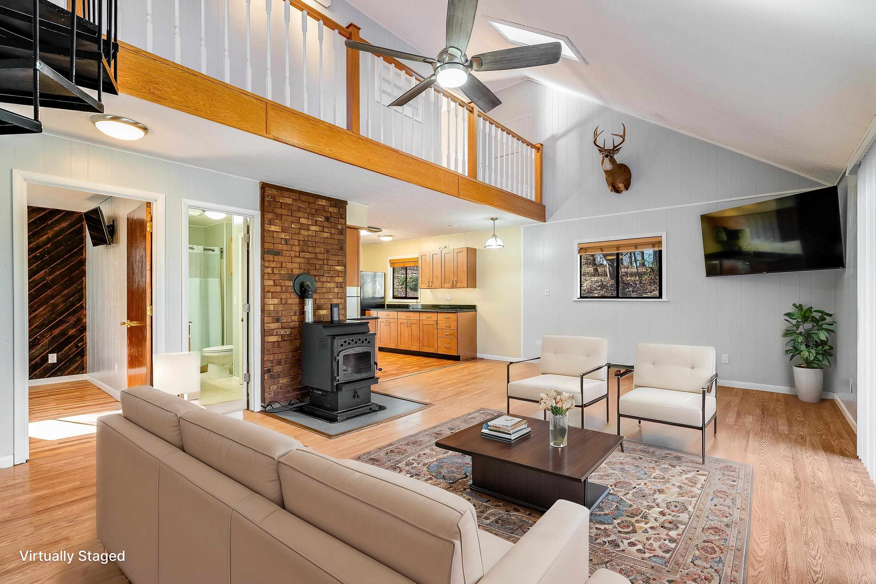 2497 Lacey Spring Road Broadway, VA 22815 - Photo 11 of 45 a living room with furniture and a flat screen tv