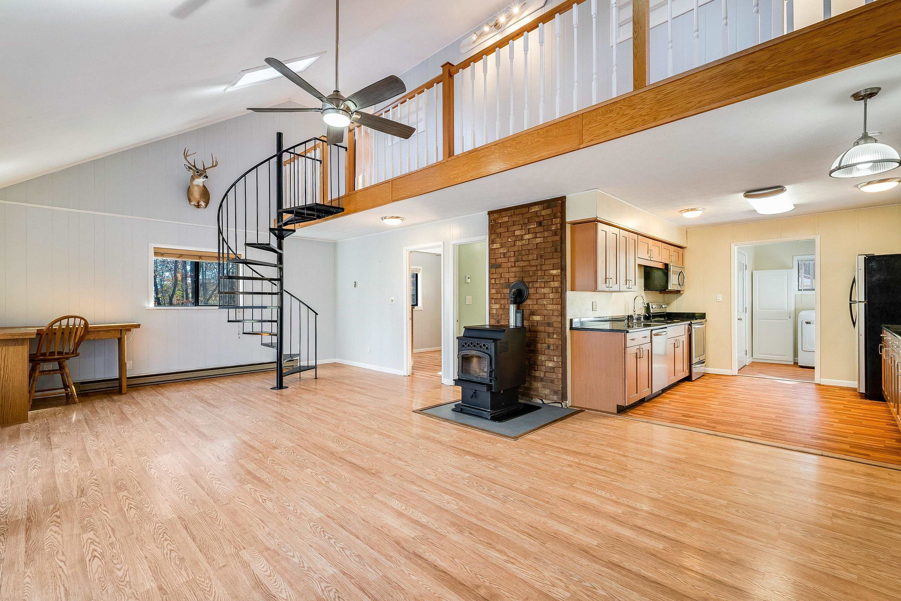 2497 Lacey Spring Road Broadway, VA 22815 - Photo 13 of 45 a view of empty room with wooden floor and ceiling fan