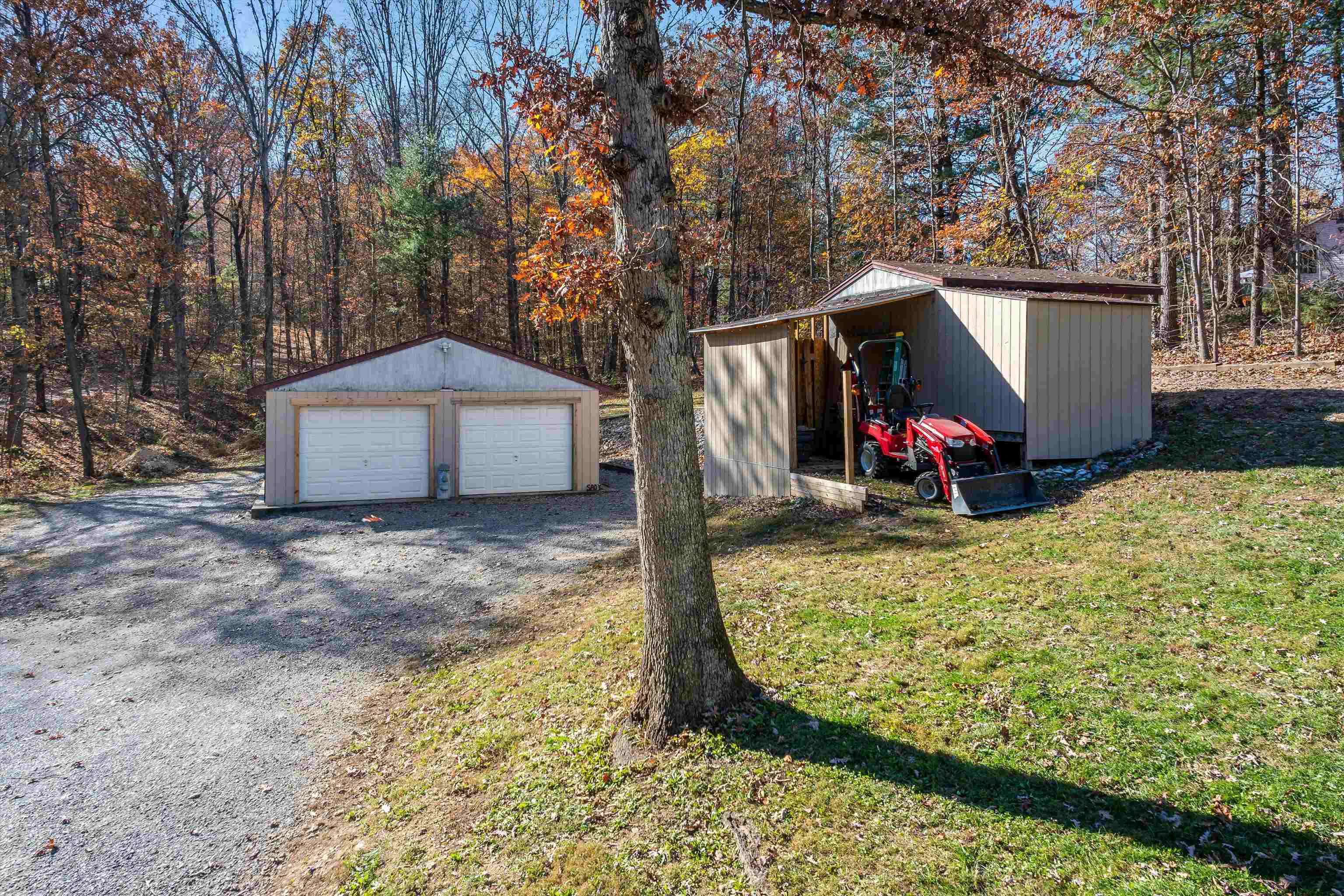 2497 Lacey Spring Road Broadway, VA 22815 - Photo 38 of 45 a view of a wooden house with a yard and large trees