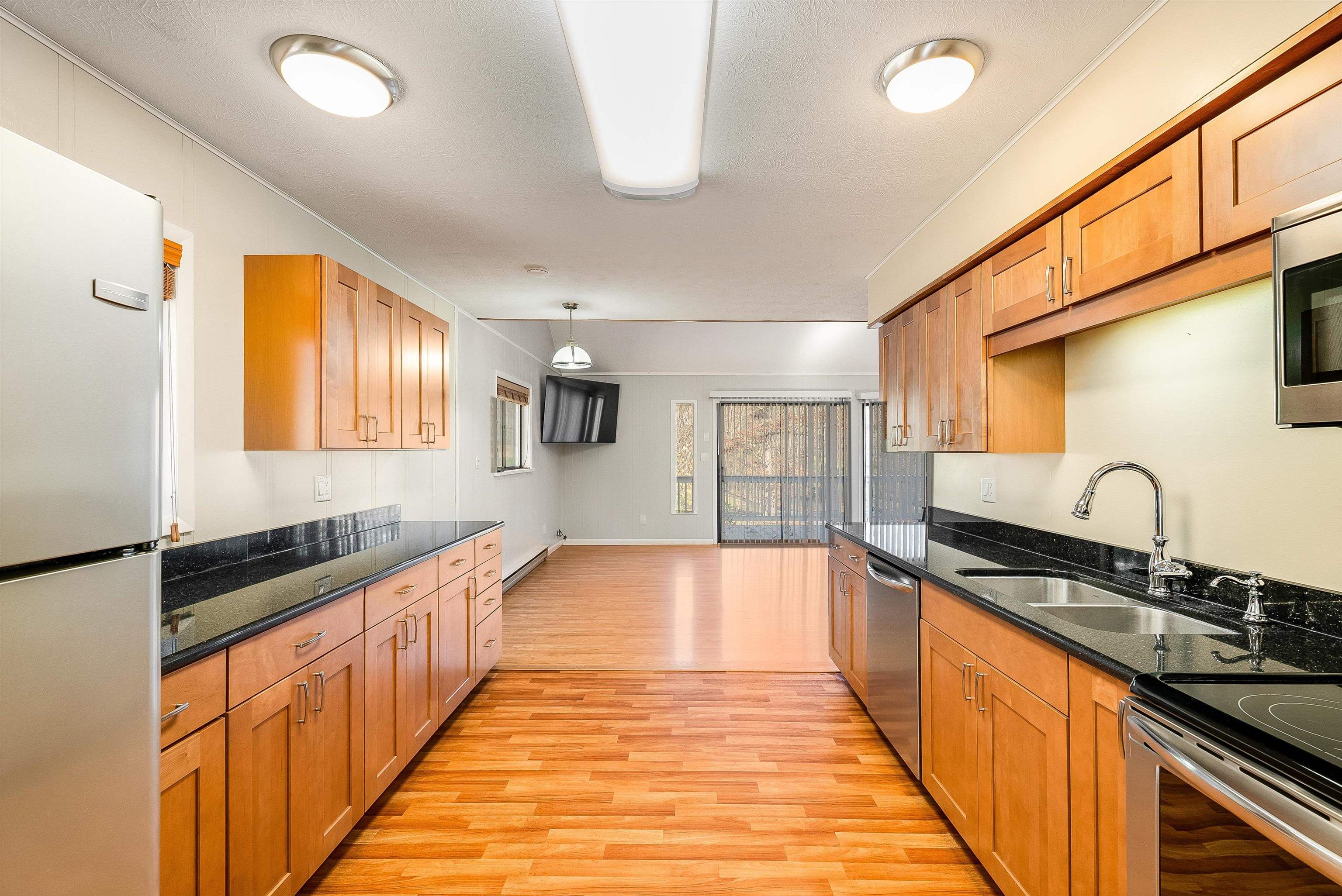 2497 Lacey Spring Road Broadway, VA 22815 - Photo 7 of 45 a kitchen with granite countertop a sink and cabinets