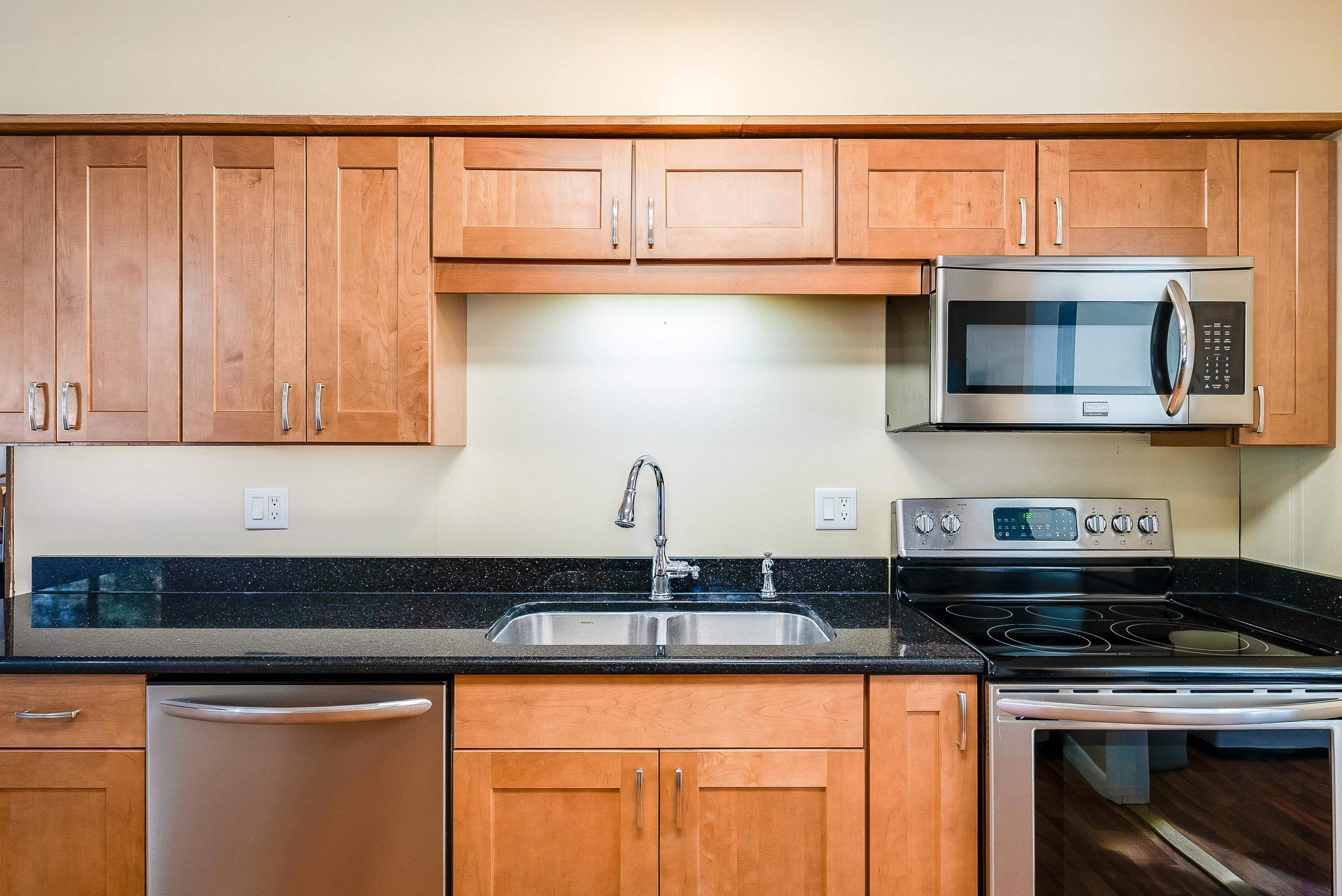 2497 Lacey Spring Road Broadway, VA 22815 - Photo 9 of 45 a kitchen with stainless steel appliances granite countertop a sink a stove and a microwave