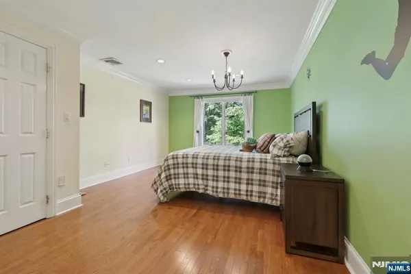 a bedroom with bed and window