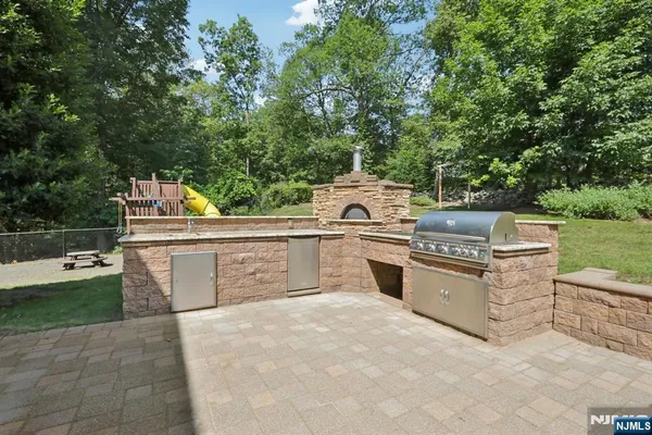 a view of a kitchen with stove and kitchen