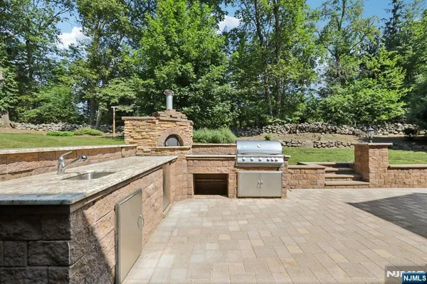a view of a kitchen with a sink and stove