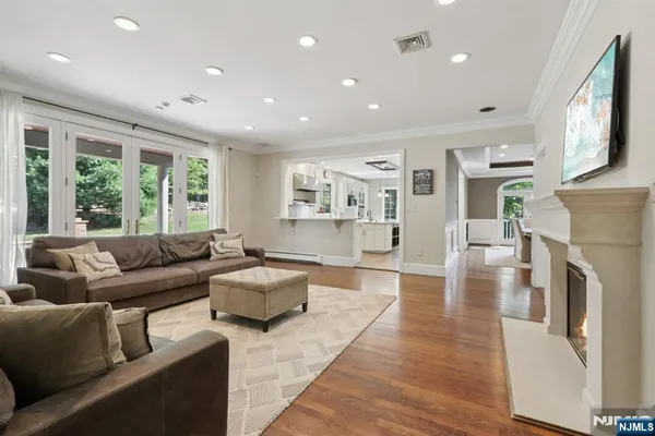 a living room with furniture and a fireplace
