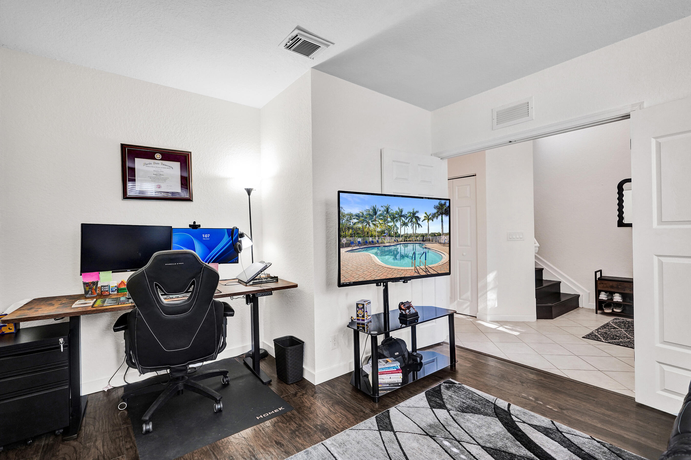 4533 Danson Way Delray Beach, FL 33445 - Photo 27 of 88 a view of a workspace with furniture and gym equipment