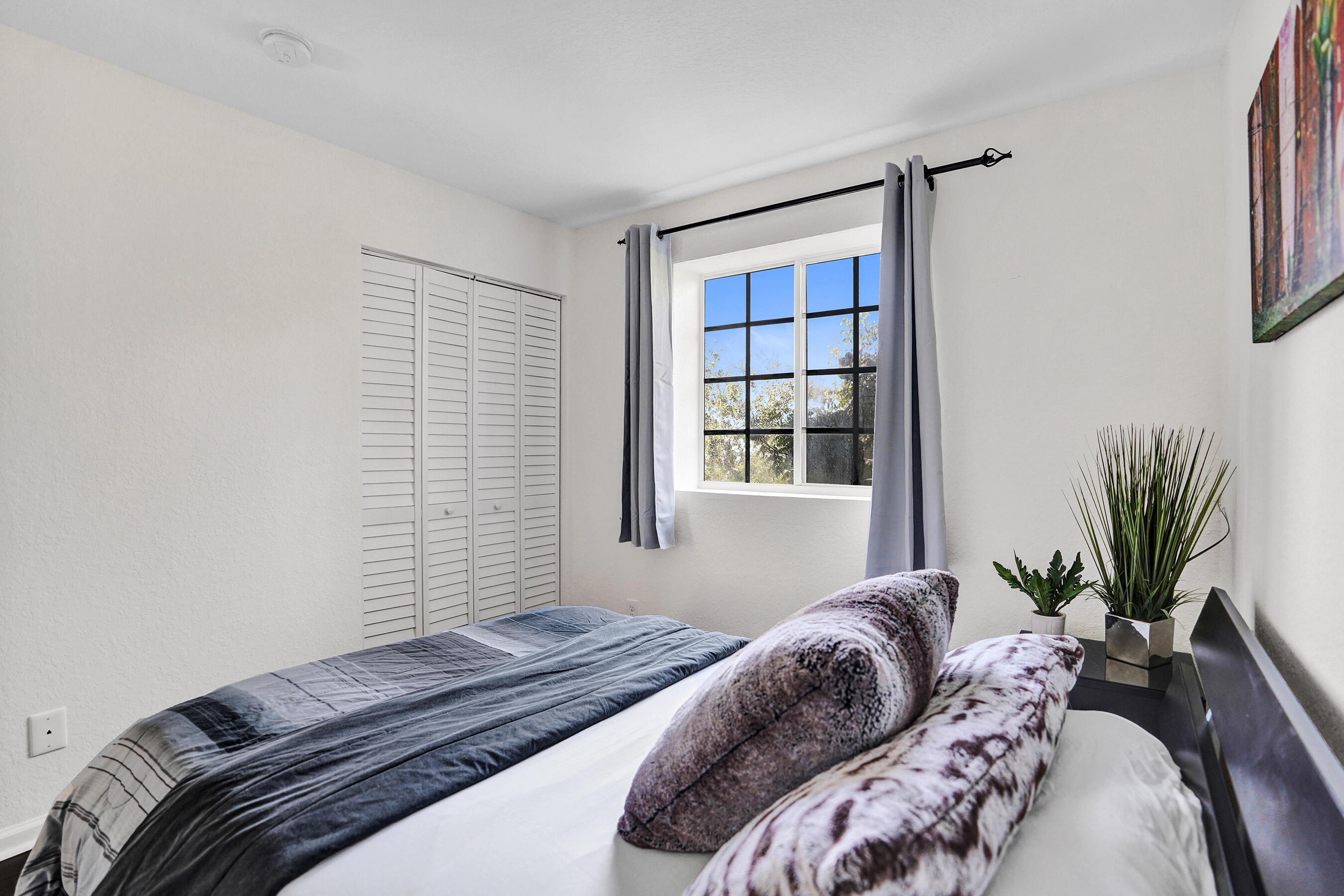 4533 Danson Way Delray Beach, FL 33445 - Photo 35 of 88 a bedroom with a bed and a window