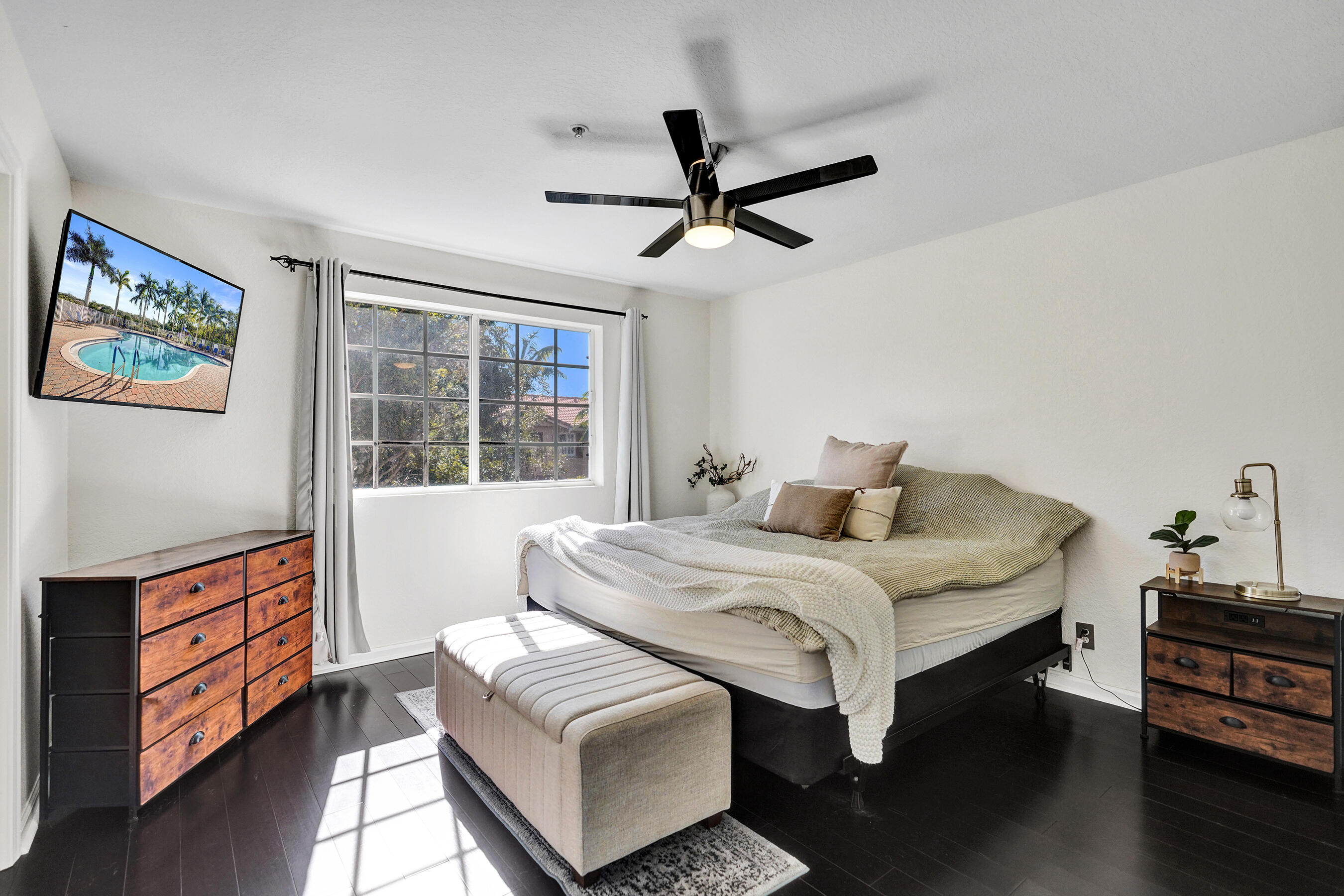4533 Danson Way Delray Beach, FL 33445 - Photo 38 of 88 a bedroom with a bed and a dresser next to a window