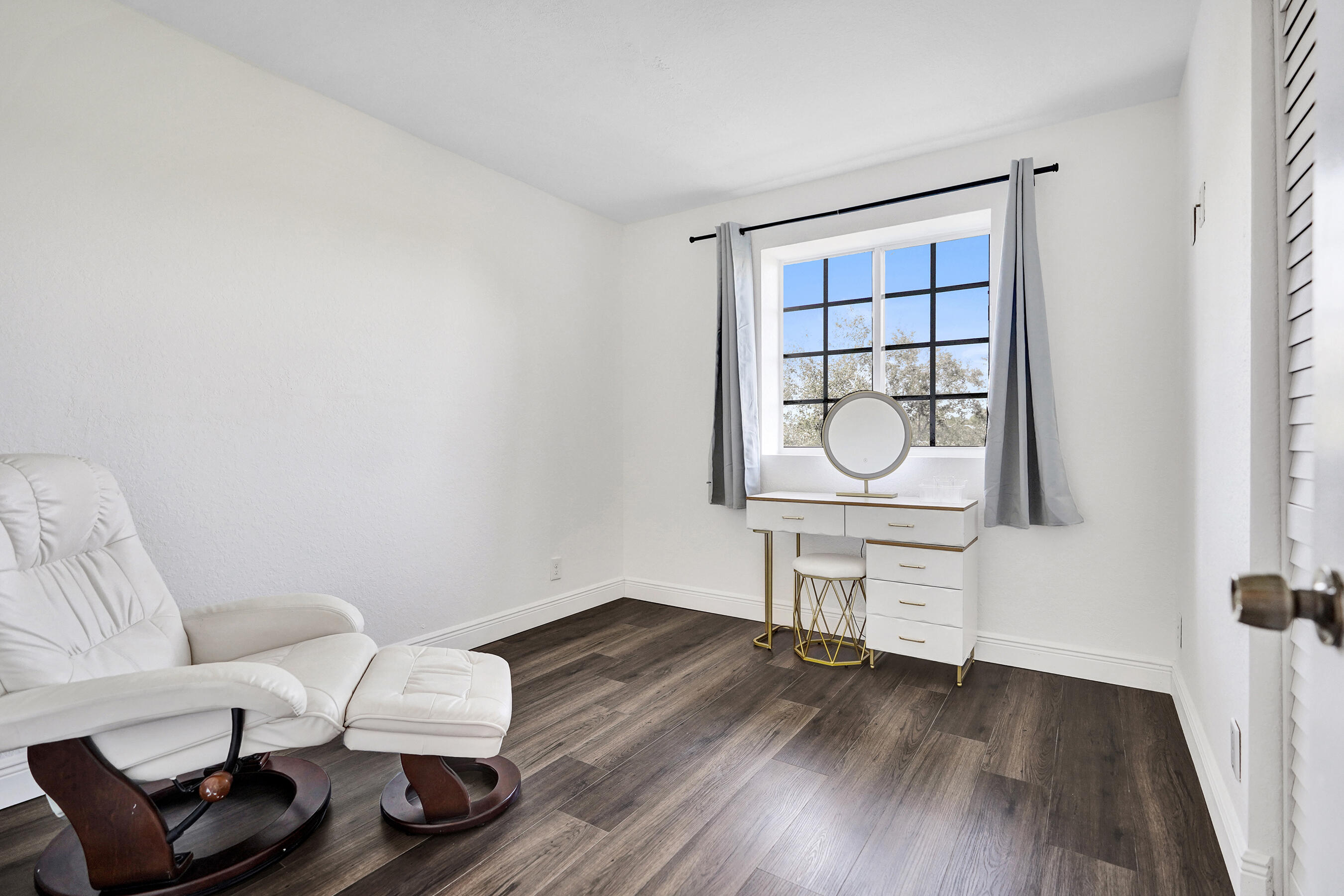 4533 Danson Way Delray Beach, FL 33445 - Photo 46 of 88 a living room with furniture a window and wooden floor