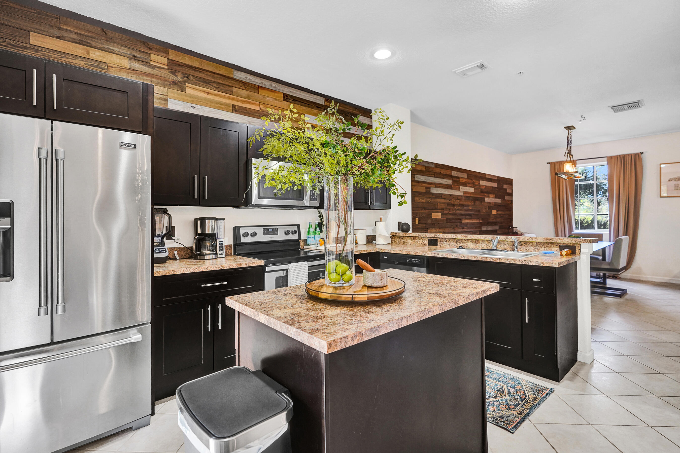 4533 Danson Way Delray Beach, FL 33445 - Photo 5 of 88 a kitchen with granite countertop stainless steel appliances a refrigerator a sink a stove and a refrigerator