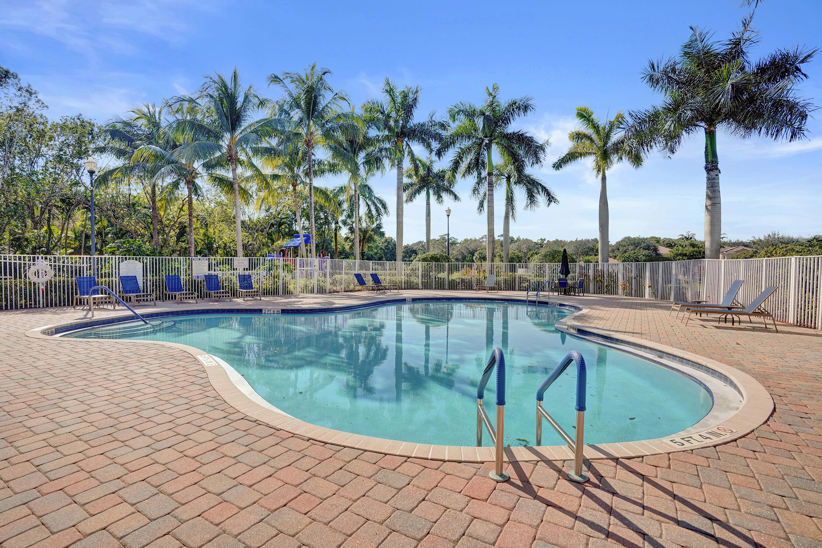 4533 Danson Way Delray Beach, FL 33445 - Photo 64 of 88 a view of a swimming pool with a lounge chair