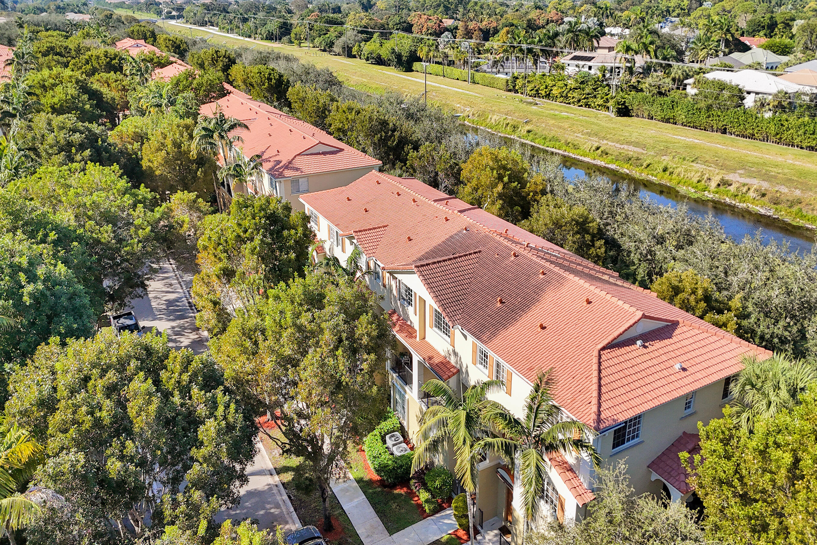 4533 Danson Way Delray Beach, FL 33445 - Photo 79 of 88 an aerial view of a house with a yard and lake view in back