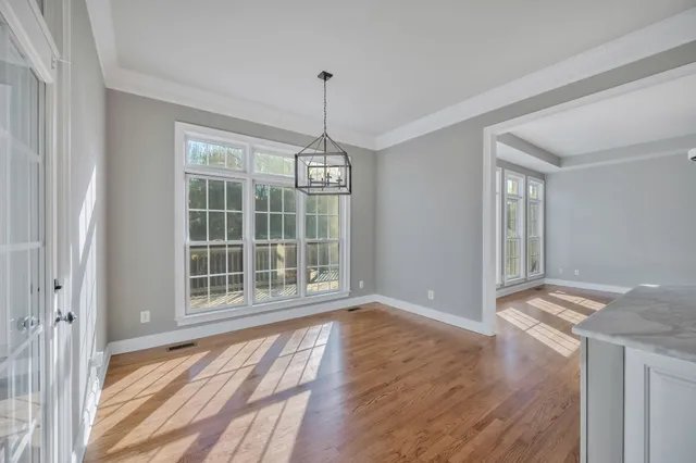 a bathroom with a sink a large mirror and a bathtub