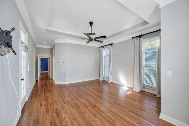 a view of an empty room with a kitchen