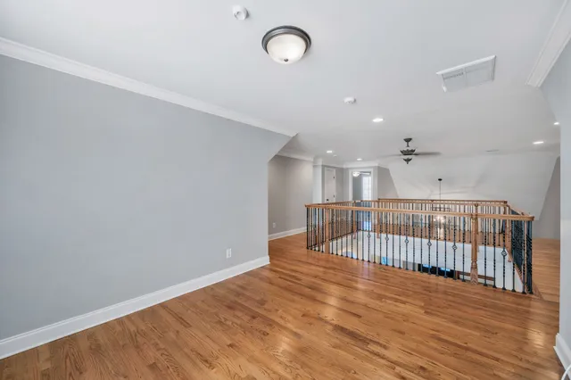a spacious bathroom with a granite countertop sink a mirror and a bathtub