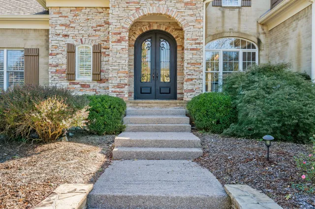 a view of staircase with wooden floor and a window