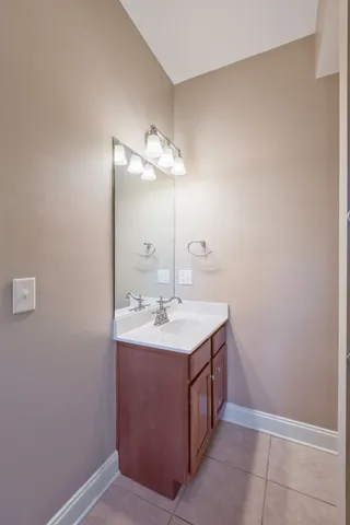 an aerial view of a houses with a lush green hillside