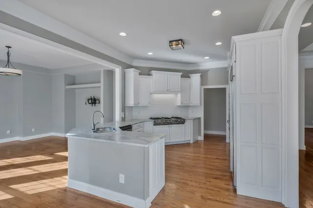 a view of a living room and chandelier