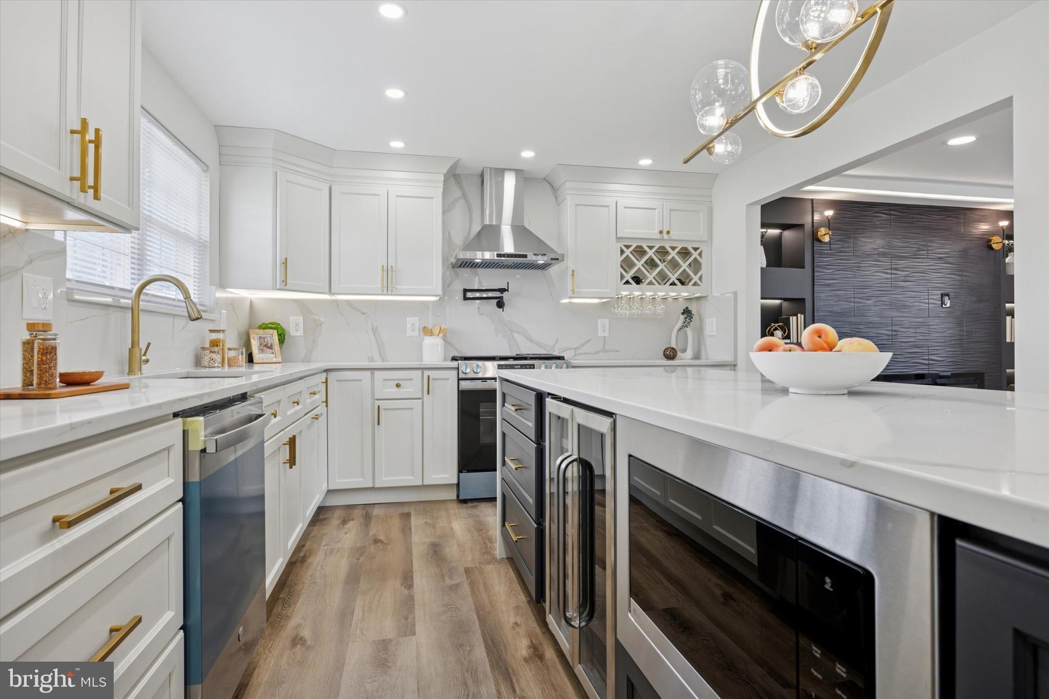 1574 Deer Run Road Warminster, PA 18974 - Photo 13 of 37 a kitchen with a sink stainless steel appliances cabinets and a window