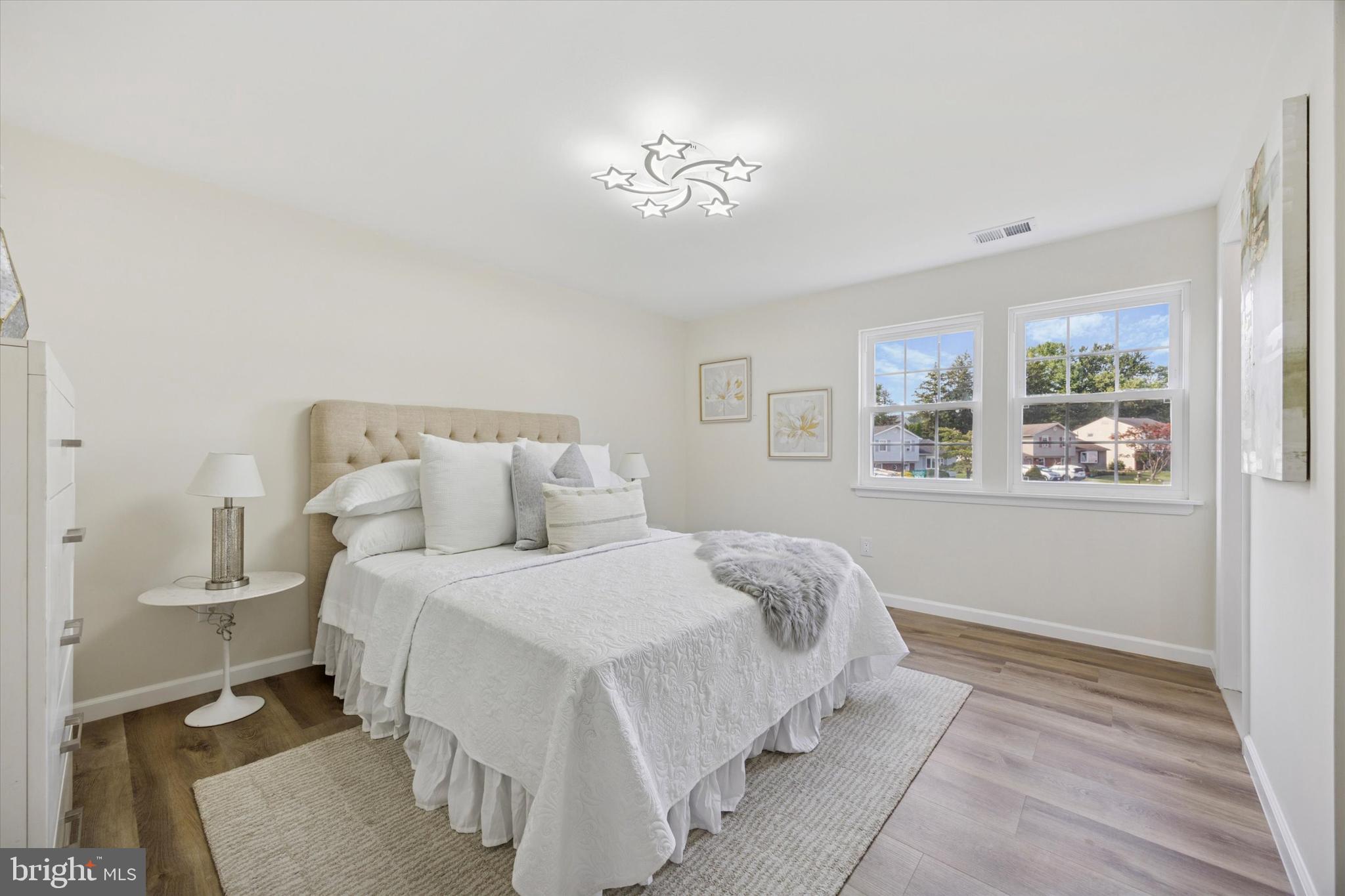 1574 Deer Run Road Warminster, PA 18974 - Photo 23 of 37 a bedroom with a large bed and a window