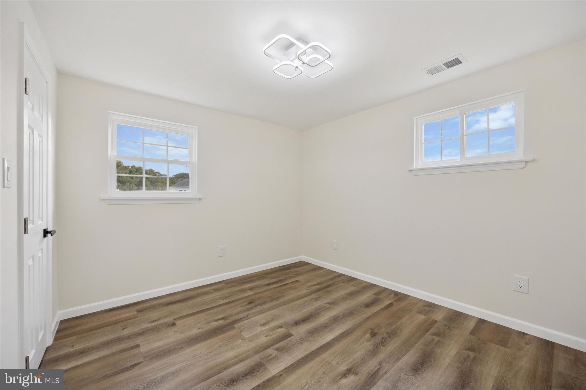 1574 Deer Run Road Warminster, PA 18974 - Photo 27 of 37 a view of empty room with wooden floor and fan