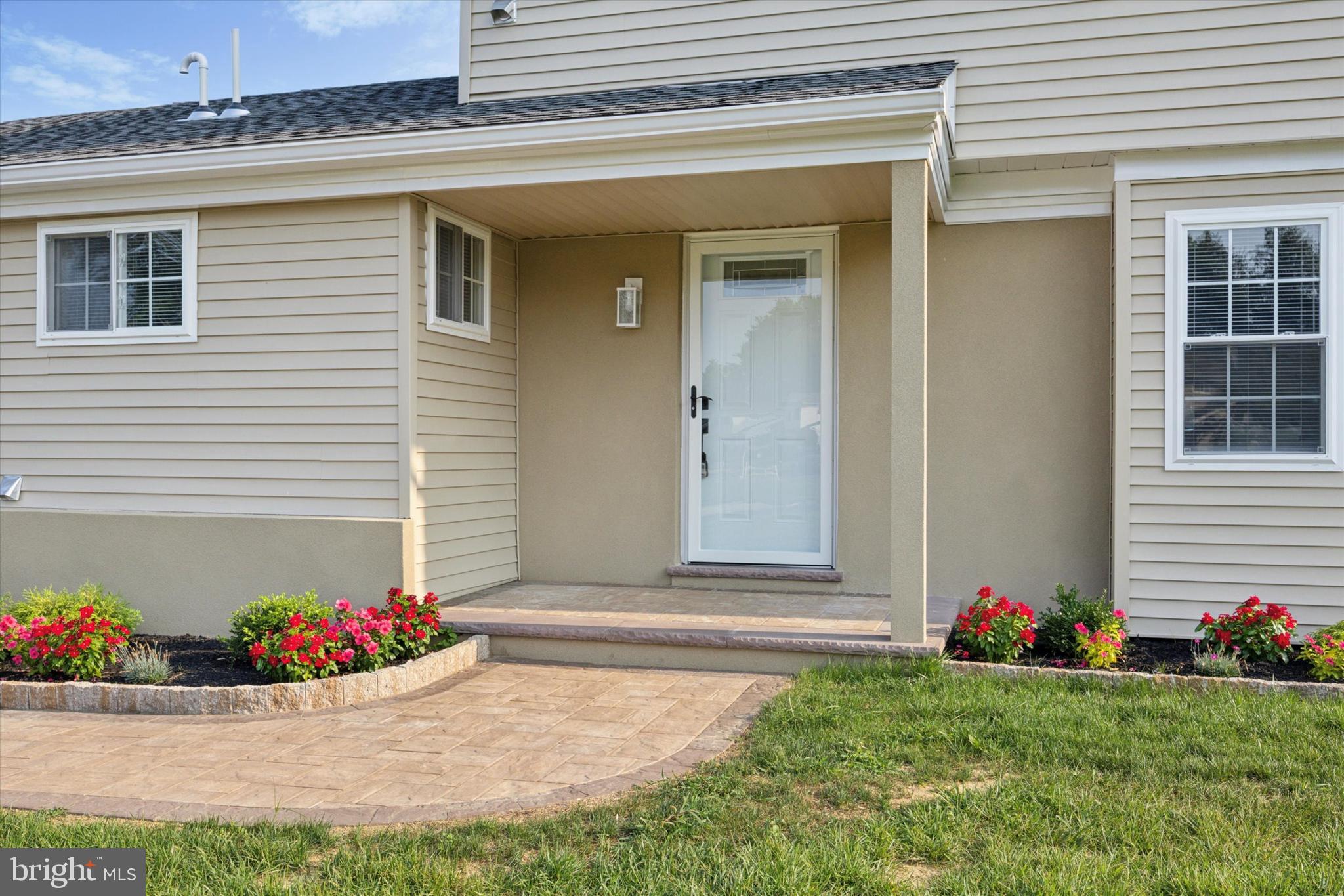 1574 Deer Run Road Warminster, PA 18974 - Photo 4 of 37 a view of a backyard with plants and flowers