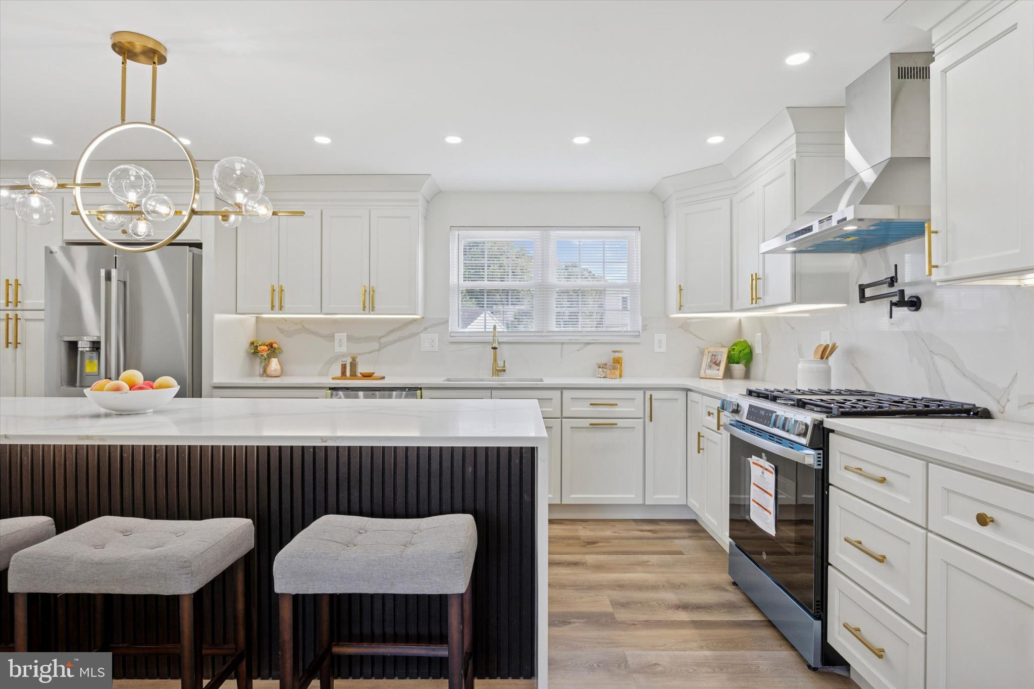 1574 Deer Run Road Warminster, PA 18974 - Photo 8 of 37 a kitchen with granite countertop a table chairs stove a sink and dishwasher
