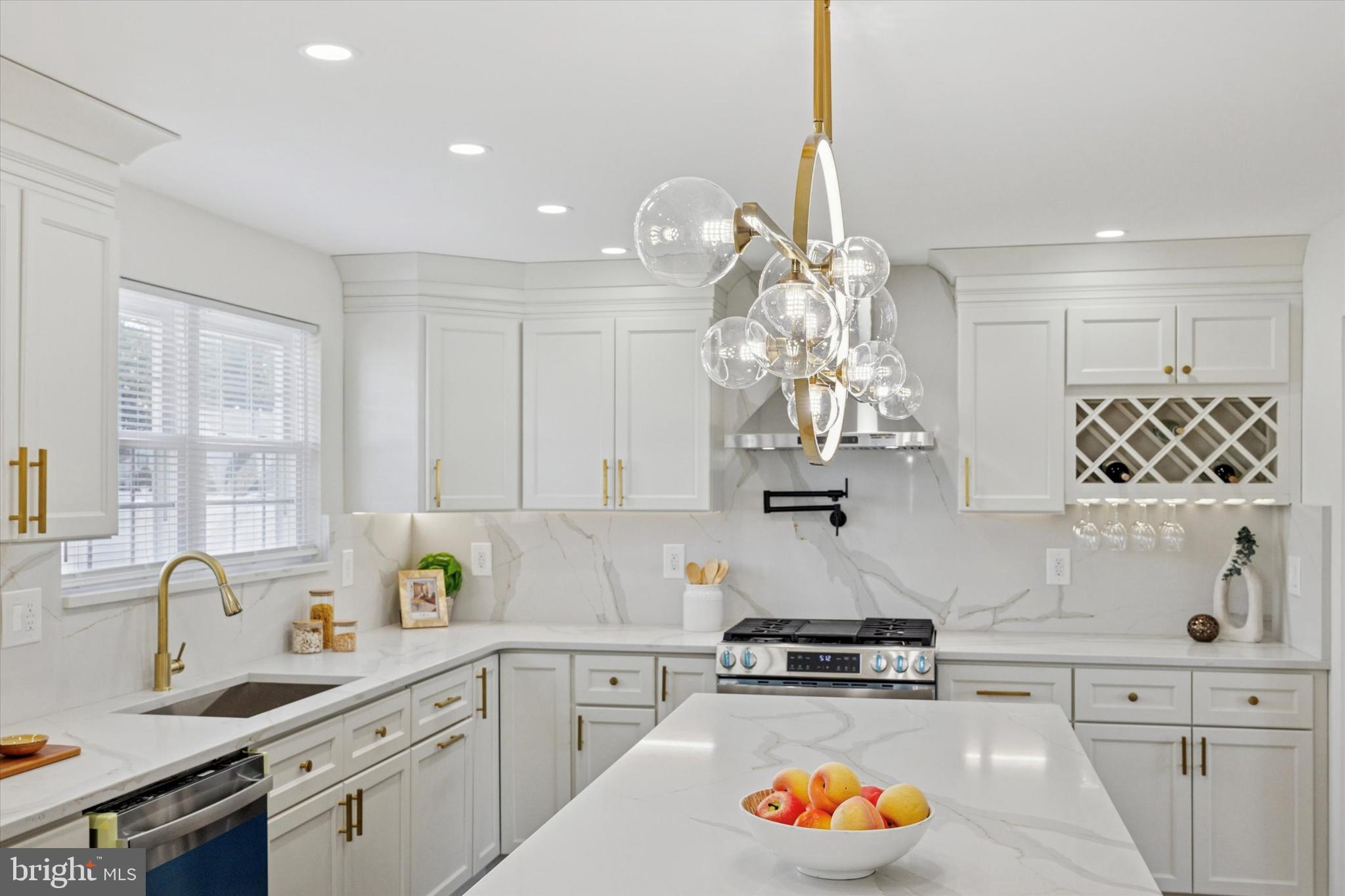 1574 Deer Run Road Warminster, PA 18974 - Photo 9 of 37 a kitchen with stainless steel appliances granite countertop a stove a sink and a white cabinets