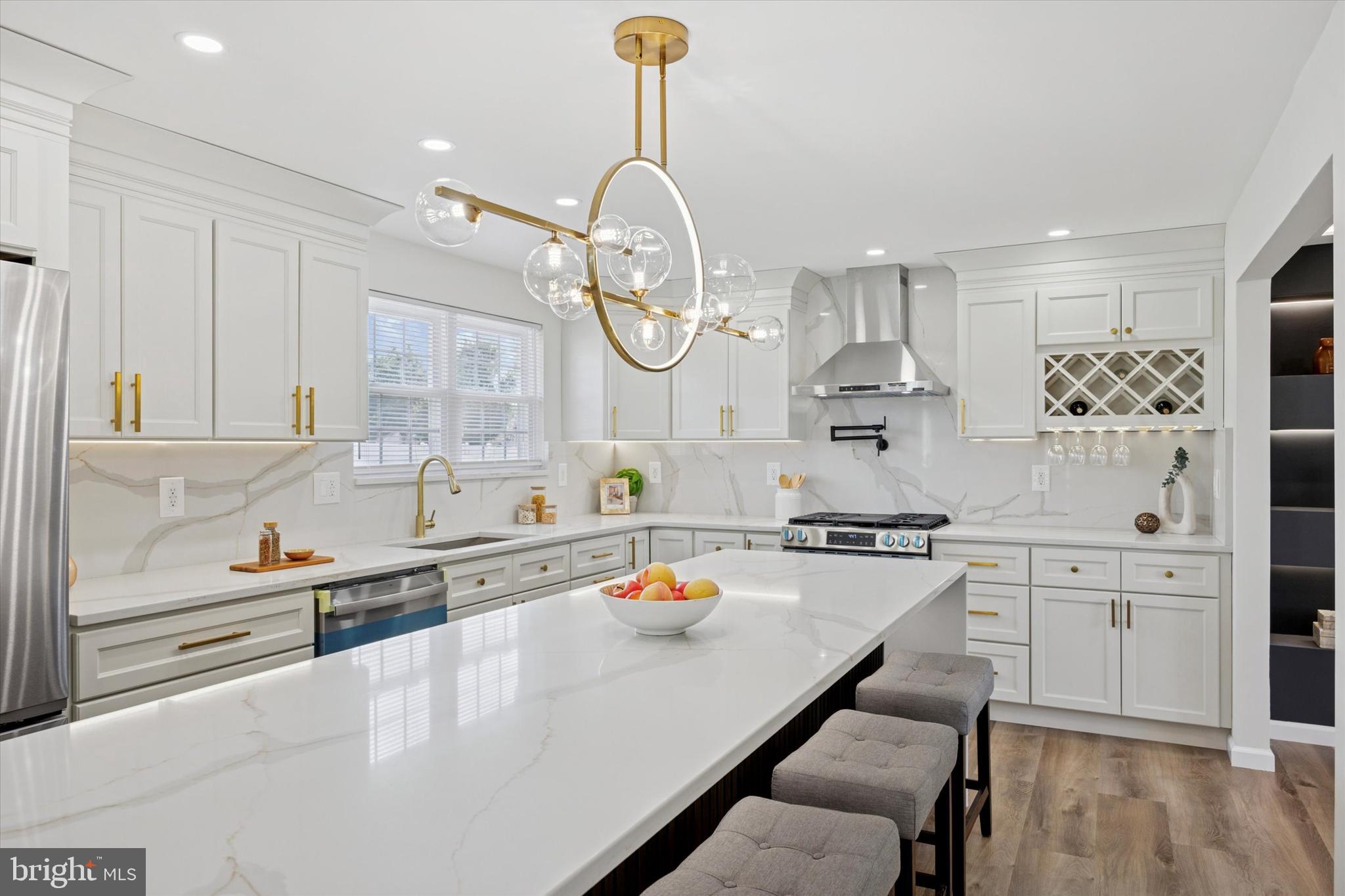 1574 Deer Run Road Warminster, PA 18974 - Photo 10 of 37 a kitchen with stainless steel appliances granite countertop a sink dishwasher a stove and a dining table with wooden cabinet